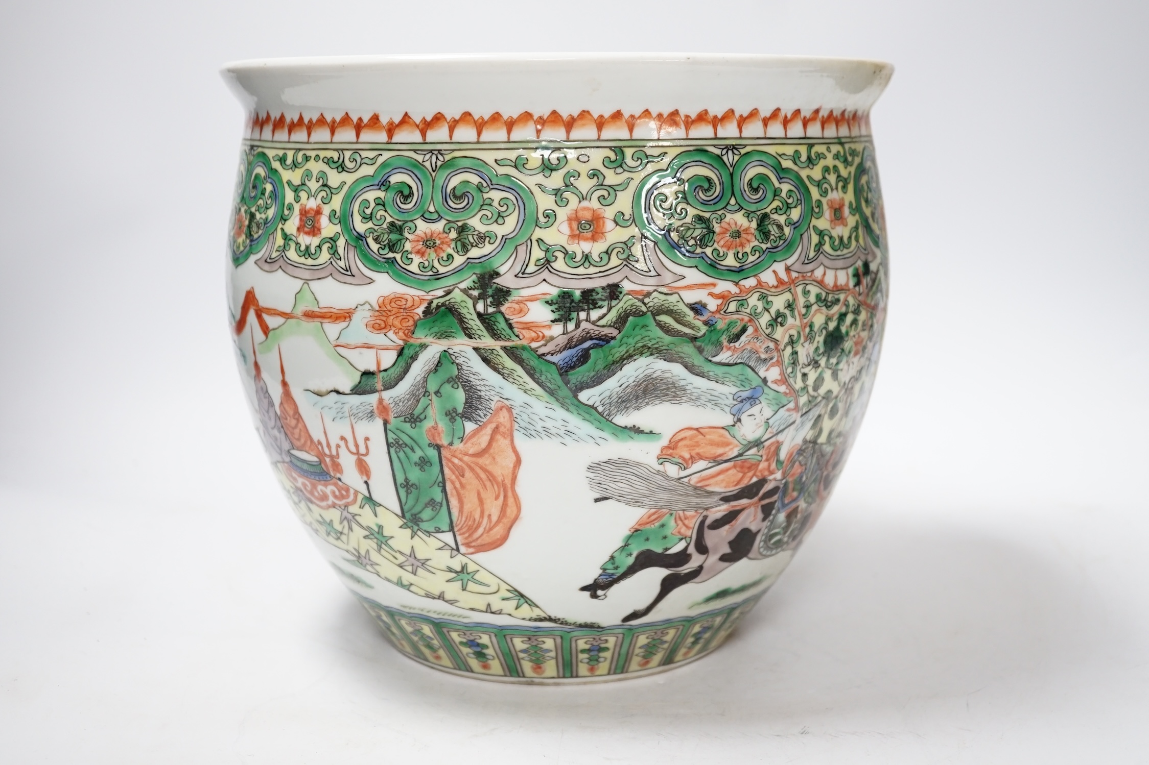 A 19th century Chinese famille verte ‘warriors’ jardiniere, 22.5cm high